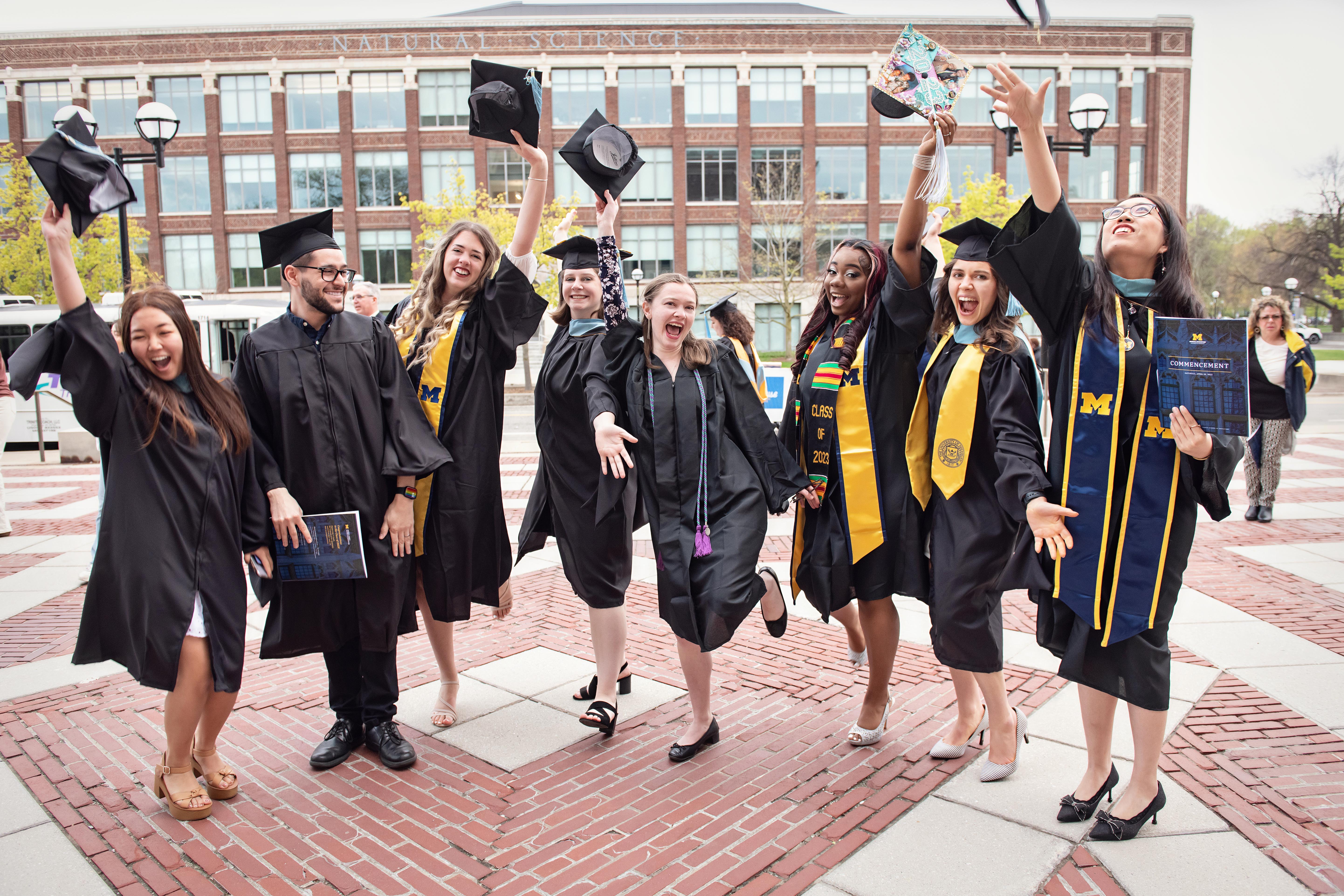 students smiling at graduation